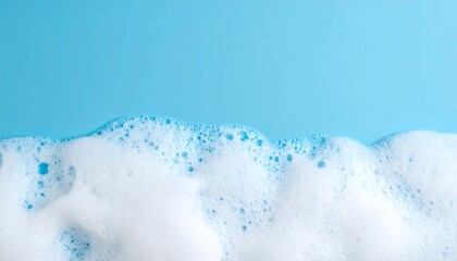 Detergent foam bubble on blue background, soap, shower gel, shampoo foam texture, copy space