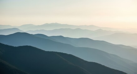 Fototapeta premium Serene Mountain Landscape with Hazy Layers at Sunrise
