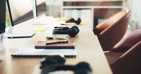 Call center, keyboard and online with headset in empty office for customer support, help desk or...