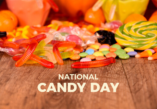 National Candy Day poster stock photo images. Colorful candies and jelly worms on wooden background. Template for background, banner, card. November 4. Important day