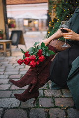 Elegant woman enjoys red wine in a charming autumn garden setting