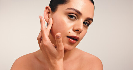 Beauty, skincare and girl in portrait in studio with skin hydration, collagen results and glow. Clean, person and confidence on white background for anti aging treatment, natural makeup and self care