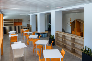 Bright and inviting workspace with modern furniture and vibrant accents for creative collaboration