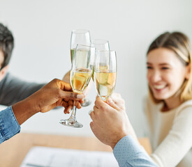 A portrait of young businesspeople celebrating business success with a tost  in the office, teamwork and togetherness concept