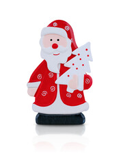 Santa Claus figurine with Christmas tree. Stock photo