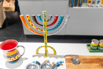 Colorful Hanukkah Menorah on White Table