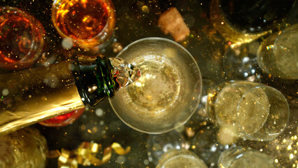 Freeze motion of pouring champagne into flute. Concept of celebration and success. © Lukas Gojda
