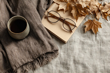 Mystical Autumn Still Life with Candles, Tarot, Dried Herbs, and Smoke in Chiaroscuro Lighting with Copy Space.