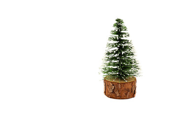 
Decorative Christmas tree isolated on a white background. Miniature fir tree. Christmas card with copy space.
