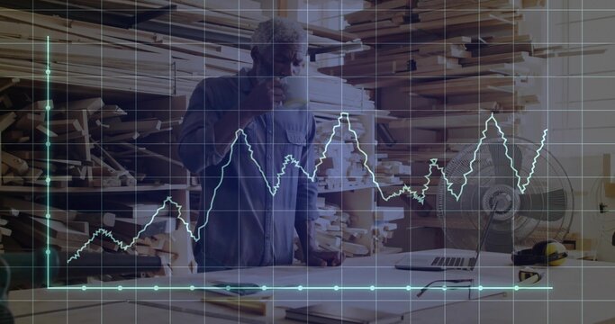 Carpenter holding mug and examining blueprints in carpentry workshop with grid, line graph overlay