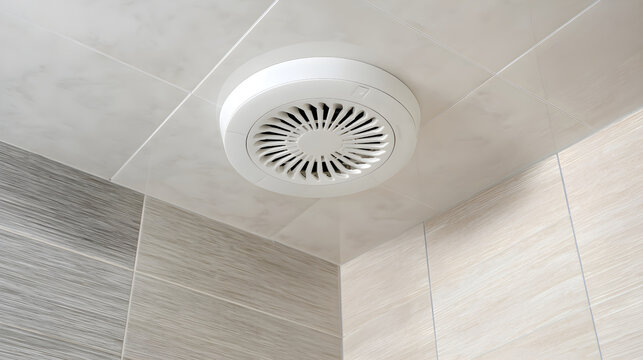 Modern bathroom ceiling exhaust fan installed in stylish tiled shower area with clean design