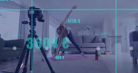 Woman in activewear performing side stretch on pink yoga mat in living room, with tripod camera