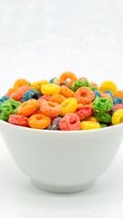 Colorful cereal rings in a white bowl
