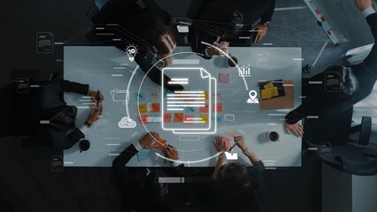 A diverse business team engages in strategic collaboration around a modern workspace table, leveraging digital tools and analytics for effective project management. Raster