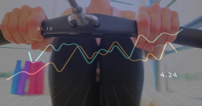 Holding cardio handlebars, woman in black activewear exercising in gym, with digital metric overlay