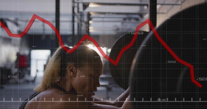 Bracing woman in sports top gripping loaded barbell under rack in gym, with grid graph overlay - Powered by Adobe