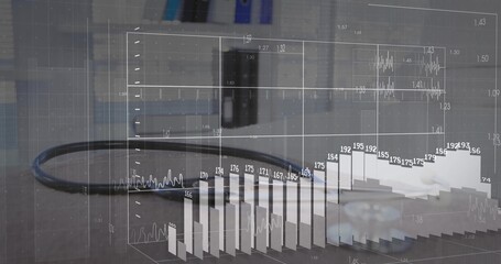 Displaying black cable with 3D data overlay on grey office desk, featuring gear piece and monitor