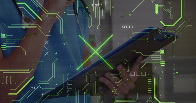 Scanning doctor in scrubs with stethoscope using tablet in clinic neon circuit overlay, binary code - Powered by Adobe