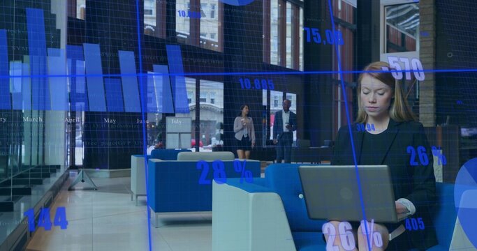 Working woman wearing black blazer typing on laptop in lobby, with data overlay, copy space - Powered by Adobe