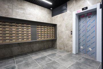 mailboxes in the lobby of an apartment building