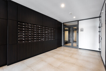 mailboxes in the lobby of an apartment building