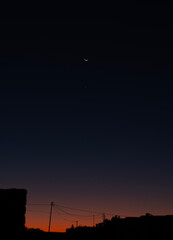 Approach. The Moon, Venus, and Regulus on the Greek island of Mykonos in Greece.