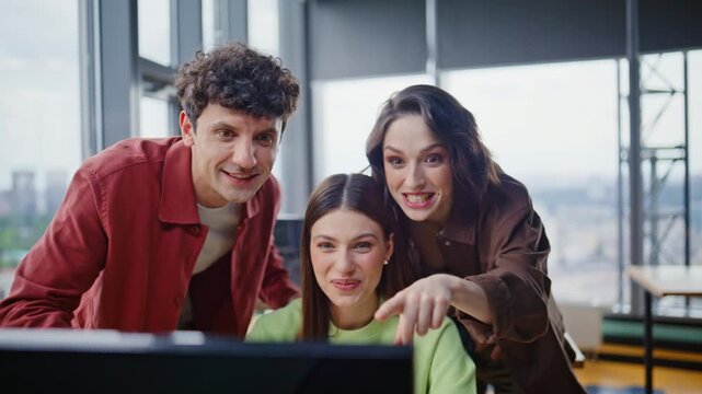 Startupers discussing project online talking to laptop webcam in office closeup