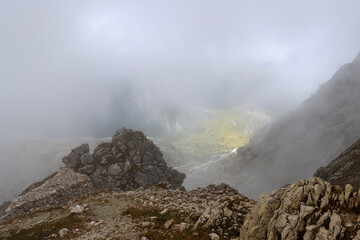 Looking down to the valley through low clouds