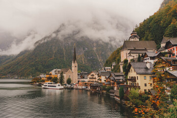 View of the church, lake and mountains from Hallstatt's most famous viewpoint on a cloudy day of autumn