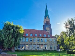 03.09.2025. Schleswig.Germany.A Historic Building with an impressive Tower set against a Bright Blue Sky during the day