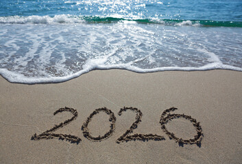 New Year 2026, lettering on the beach sand.