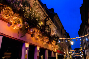 Obraz premium Street decorated for Christmas in medieval city of Strasbourg which is considered as a Capital of Christmas