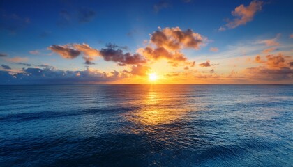 Fototapeta premium Vibrant Sunrise Over Calm Ocean Peaceful Sky Perfect For Travel Or Nature Posters