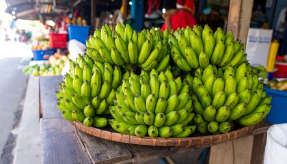 Fresh green bananas in a market stall