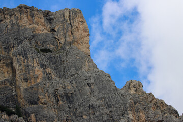 Rocky edge of the mountain under a blue sky