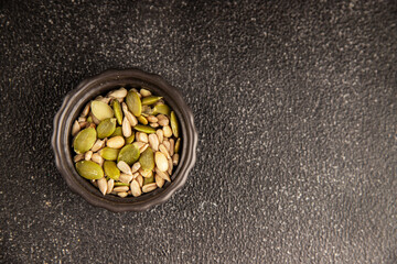 Seed mix sunflower seeds and pumpkin seeds natural product tasty snack fresh delicious gourmet food background on the table rustic top view copy space keto and paleo diet vegan and vegan food