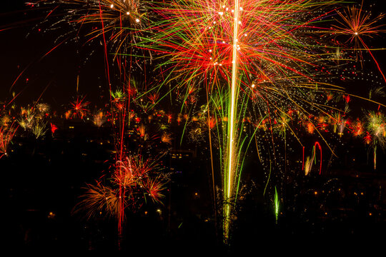 Vibrant fireworks display over cityscape