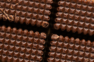 Chocolate bar in closeup. Sweet and unhealthy food.