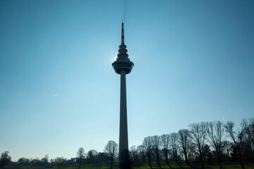 Obraz premium Silhouette of a communication tower against blue sky