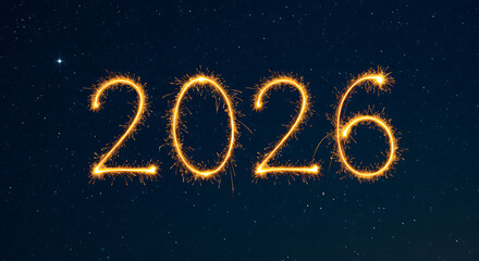 The year 2026 illuminated by sparkling golden fireworks against a starry night sky