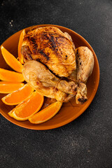 Baked chicken with oranges whole grilled chicken christmas holiday dish new year natural product tasty snack fresh delicious gourmet food background on the table rustic top view copy space
