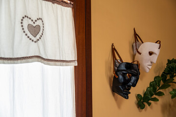 Traditional Sardinian masks worn by the Mamuthones in a typical Sardinian house.