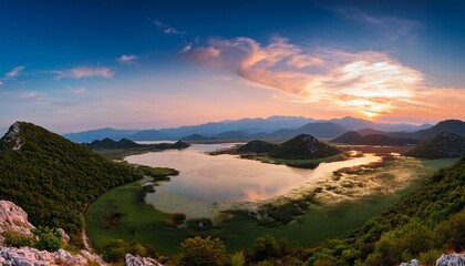 Obraz premium Majestic Skadar Lake Showcases Stunning Landscapes And Serene Waters Under A Vibrant Sky
