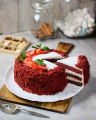 Enjoy a Red Velvet Cake with Fresh Strawberries and Cream