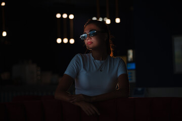 portrait of a beautiful girl in a dark night bar photo with low key lighting