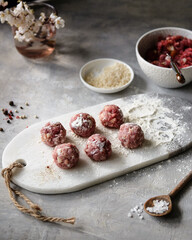 Enjoy delicious meatballs on a marble board with a variety