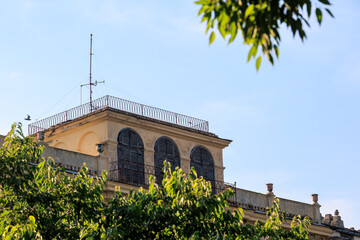 Obraz premium Historic building with arched shutters in Bastia, France, Corsica, Bastia, 20 June 2025