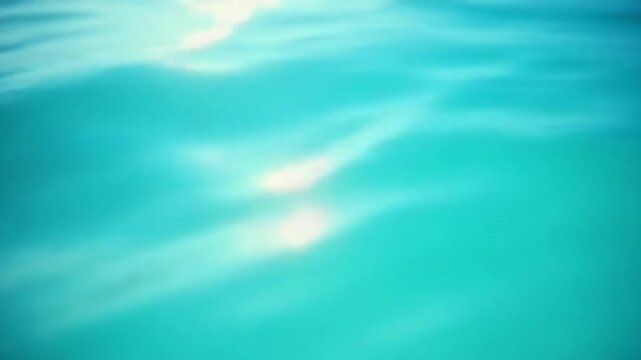 Sea water surface. Low angle view over clear azure sea water. Sun glare. Abstract nautical summer ocean nature. Holiday, vacation and travel concept. Nobody. Slow motion. Weather and climate change
