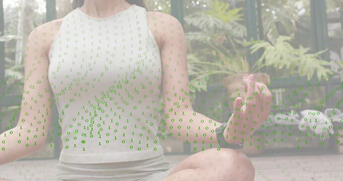 Green binary overlay streaming unveiling meditator sitting in glass greenhouse with code fading