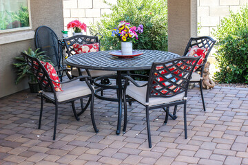 Wrought  Iron Table And Chairs On Pavers Patio